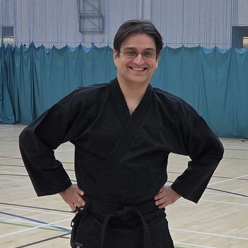 Duncan Wright in a black gi in a sports hall