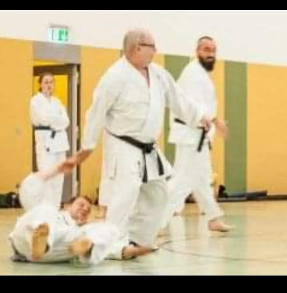 A partner thrown to the floor during ground work